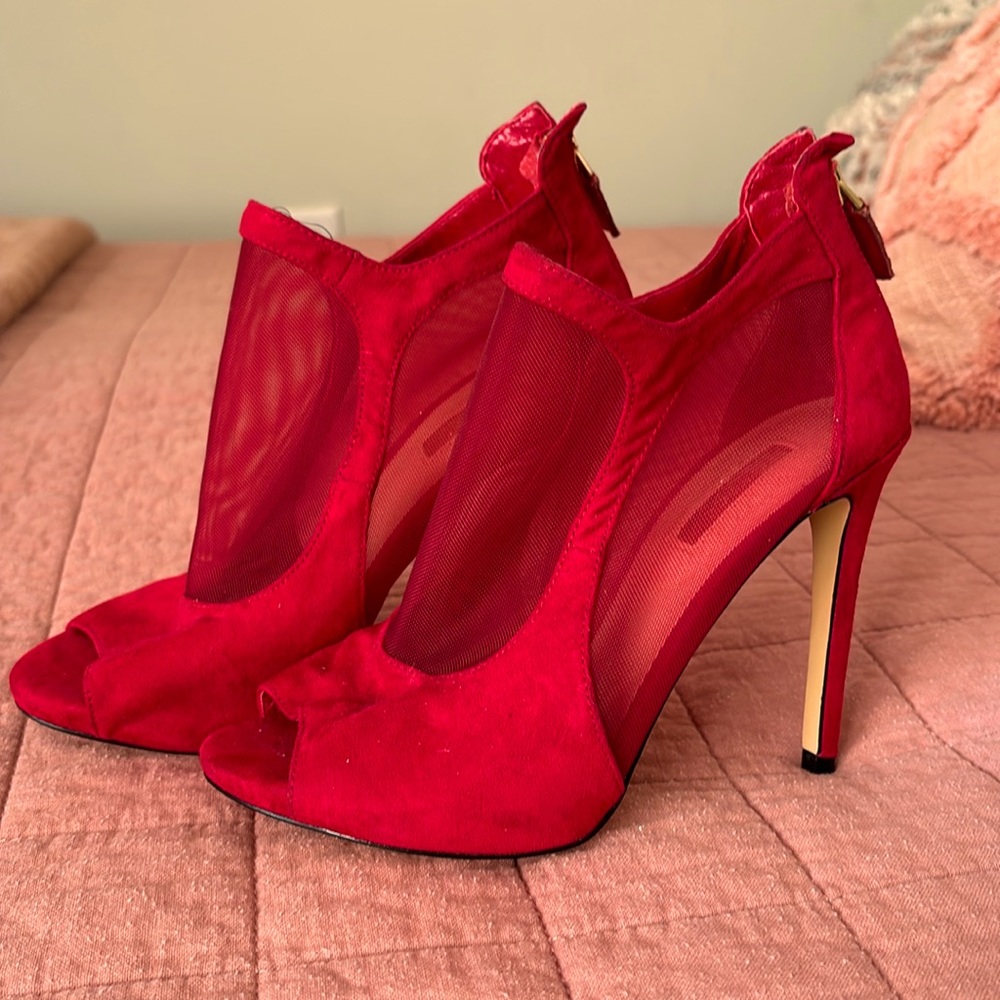 Guess gently used Red high heel mesh pumps!